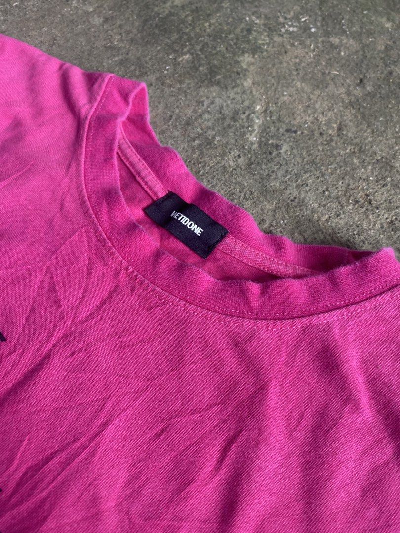 We11done Pink Repeated Logo T-Shirt (Category: Shirts) located in Caloocan City. Submitted by remythrift (Listing ID 1470589590, Image 3). Description: - Brand: We11done - Color: Bright pink with stacked black logo print - Size: Tagged M (oversized, fits like one-size) - Material: Cotton and polyester blend (Made in Korea) - Condition: Light wear from normal washing.