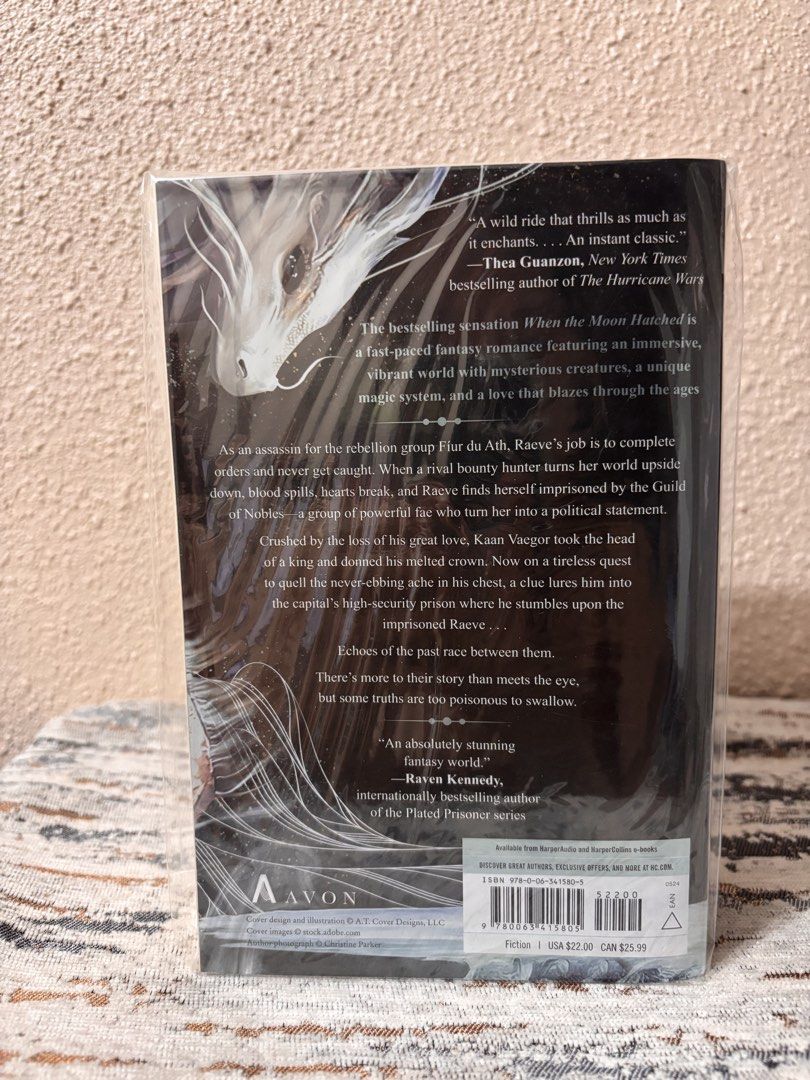When The Moon Hatched by Sarah A. Parker Paperback (Category: Storybooks) located in Caloocan City. Submitted by boldstorm-6421 (Listing ID 1470730837, Image 2). Description: - Title: Book One of The Moonfall Series by Sarah A. Parker - Publisher: Avon - Format: Paperback (ISBN: 978-0-06-341580-5) - Genre: Fast-paced fantasy romance with dragons, fae, and political intrigue - Condition: Unread copy, wrapped in clear protective plastic with minor 