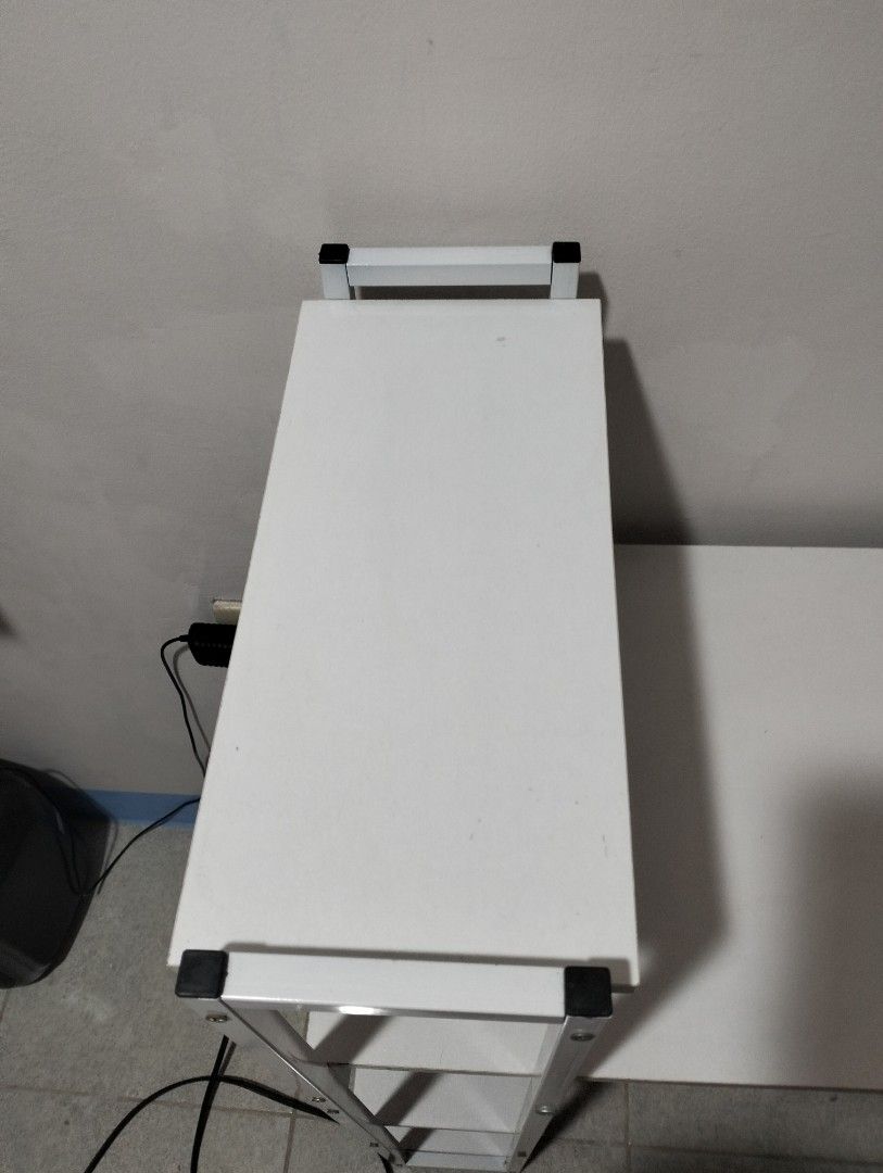 White Computer Desk with Attached Shelves and Bookshelf (Category: Tables & Sets) located in Paranaque City. Submitted by _andreaaaa13 (Listing ID 1470719376, Image 3). Description: bought for 928 will sell for 750. - Used for 1 year - Pinatungan lang ng mga gamit pang nails. - May mga minimal lang na stain but hindi sobrang halata. last 2 photos yan ang mga nakalagay. The buyer will shoulder the delivery fee. I can disassemble the table..