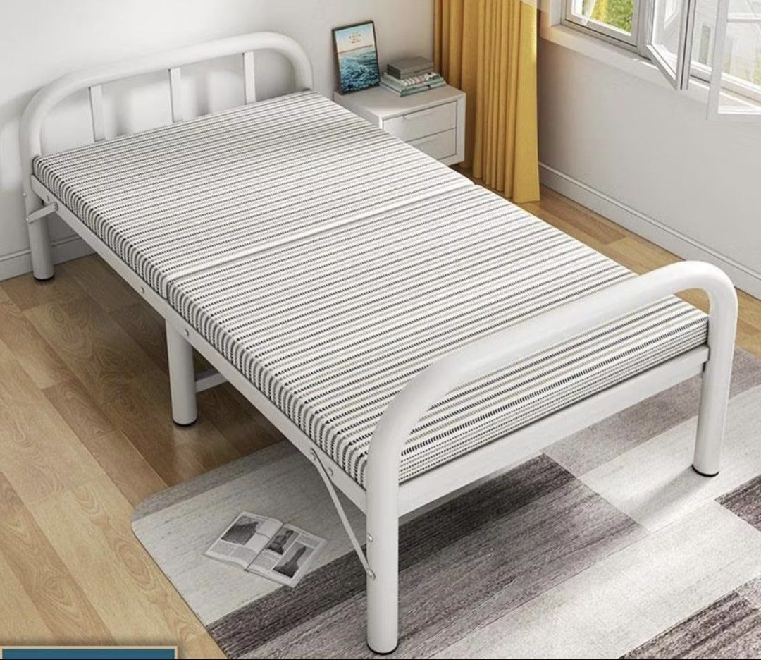 White Foldable Bed (Category: Bed Frames & Mattresses) located in Manila. Submitted by ms.aaaaa (Listing ID 1470558404, Image 1). Description: -Dimensions: 75CM= 180 X 75 X 40 CM -there's a missing screw but can hold still -expect some wear and tear -already folded and covered with stretch film location: Parañaque .