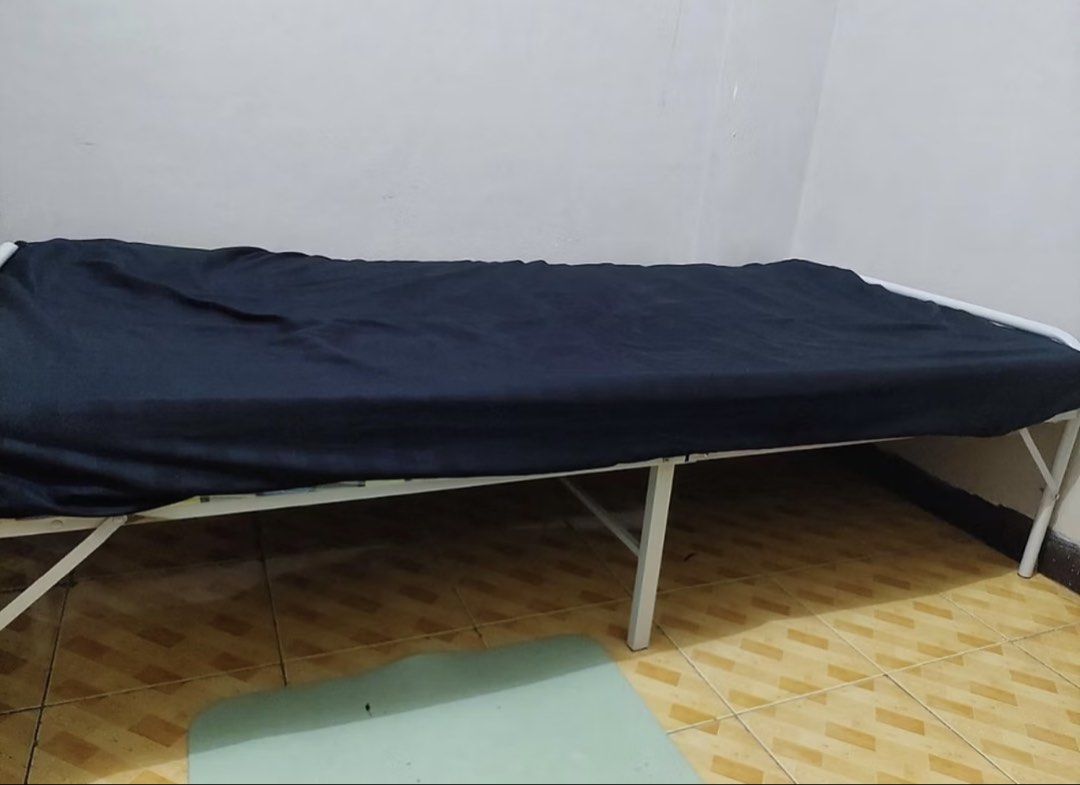 White Foldable Bed (Category: Bed Frames & Mattresses) located in Manila. Submitted by ms.aaaaa (Listing ID 1470558404, Image 3). Description: -Dimensions: 75CM= 180 X 75 X 40 CM -there's a missing screw but can hold still -expect some wear and tear -already folded and covered with stretch film location: Parañaque .