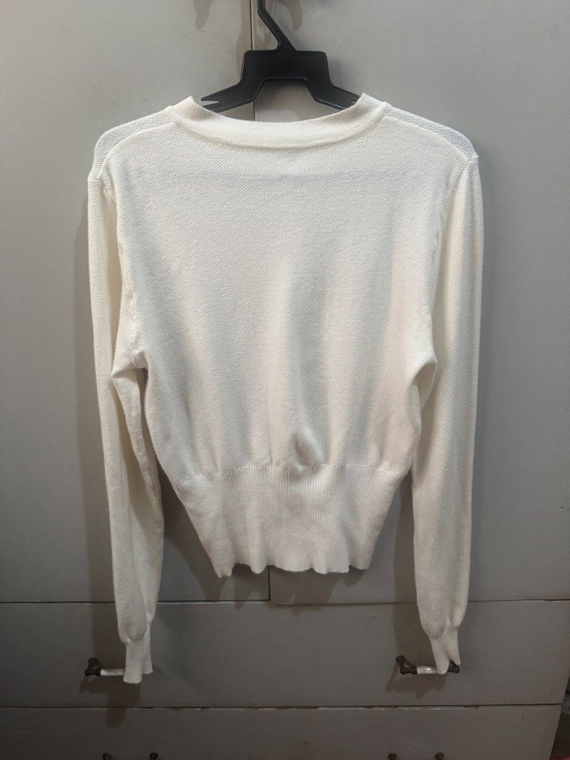 White knitted button-up cardigan long sleeve (Category: Coats, Jackets and Outerwear) located in Valenzuela. Submitted by declutter203 (Listing ID 1470607477, Image 2). Description: - Used once - Size: Small MOP: Gcash/Maribank MOD: J&T or Grab/lalamove Tags: Zara, H&M, Love Bonito, Mango, Bershka, Uniqlo, GU, Topshop, Araw the Line, SM woman, reformation dress, suzy clothing .