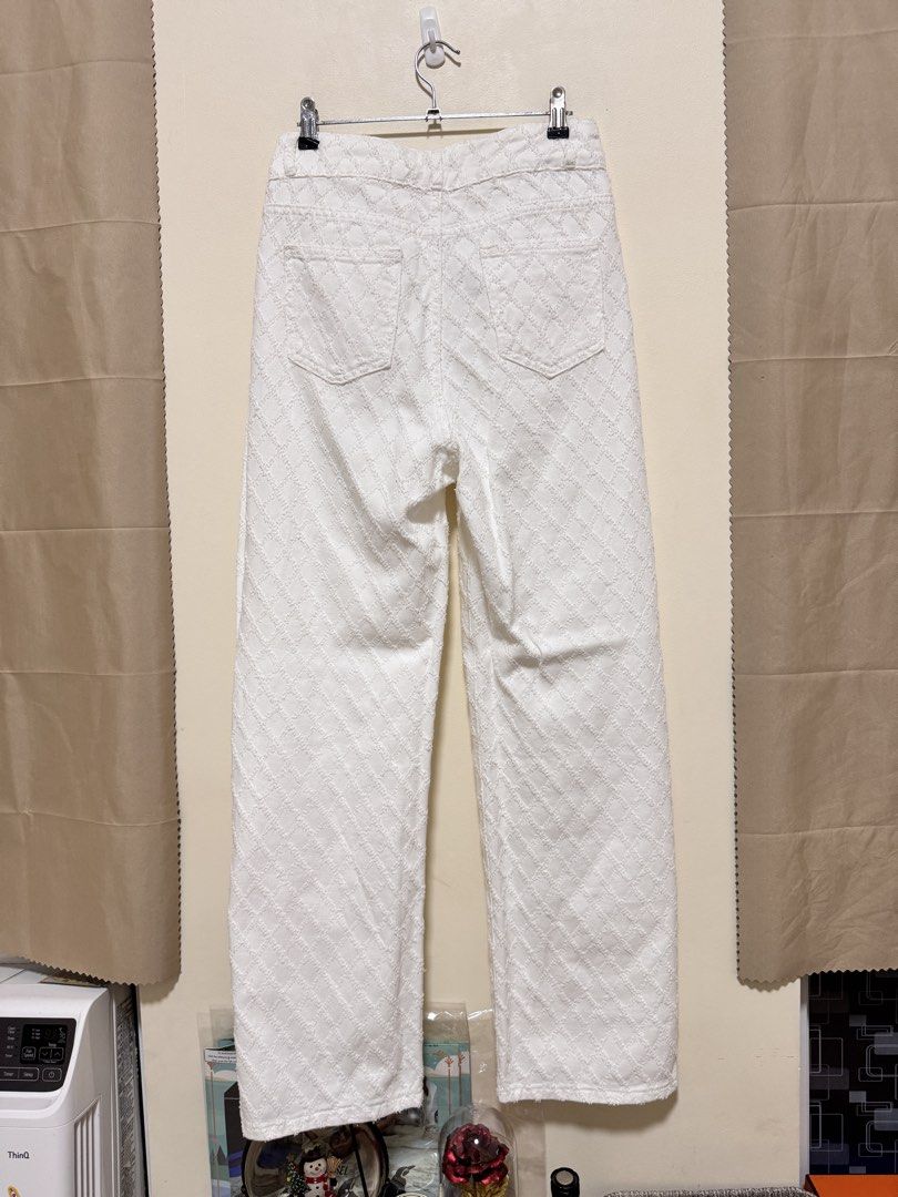 White Pants (Category: Jeans) located in Manila. Submitted by seayouncey (Listing ID 1470671586, Image 2). Description: Size: 30 inches Length 42 inches - Color: Clean white - Design: Diamond checkered textured pattern - Fit: High waisted, straight wide leg with raw hem - Closure: Double button and zipper fly - Pockets: Standard front and back pockets - Condition: Great overall.