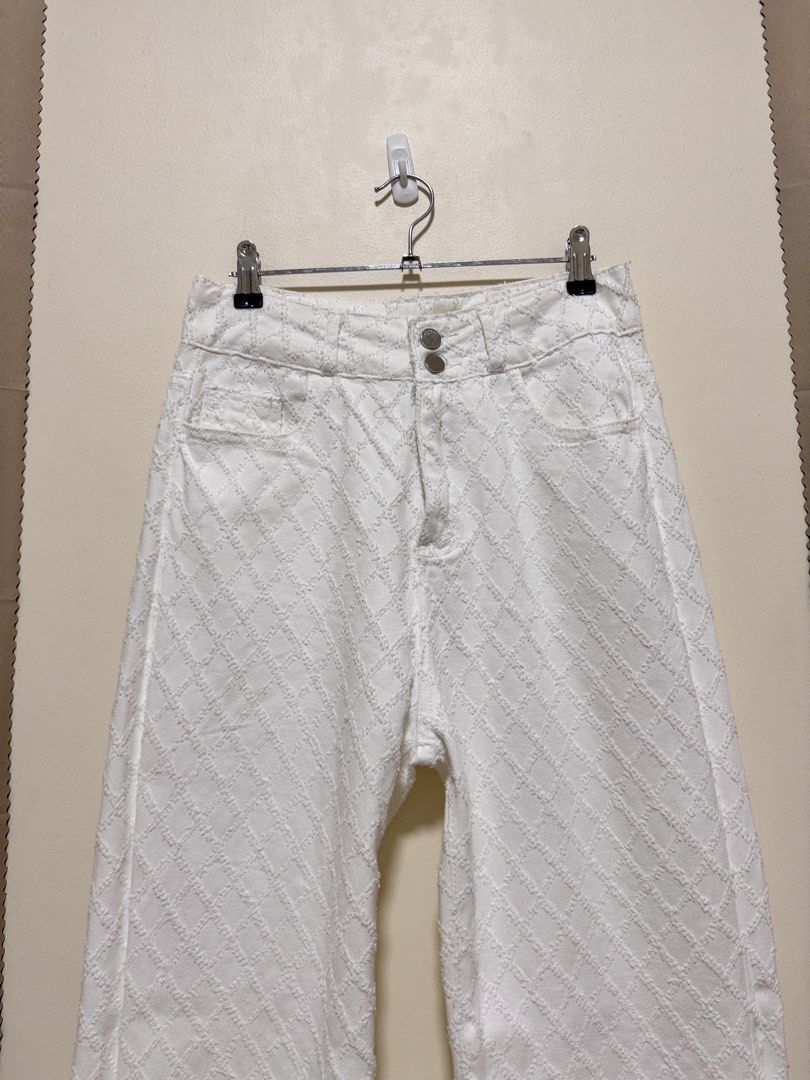 White Pants (Category: Jeans) located in Manila. Submitted by seayouncey (Listing ID 1470671586, Image 3). Description: Size: 30 inches Length 42 inches - Color: Clean white - Design: Diamond checkered textured pattern - Fit: High waisted, straight wide leg with raw hem - Closure: Double button and zipper fly - Pockets: Standard front and back pockets - Condition: Great overall.