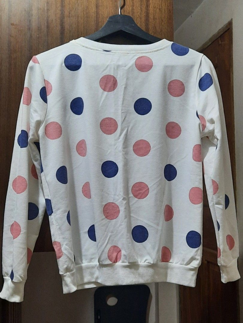 White Polka Dot Long Sleeve Sweatshirt (Category: Longsleeves) located in Manila. Submitted by gracjam_27 (Listing ID 1470694533, Image 2). Description: - Color: White with pink and dark blue polka dots - Style: Crew neck long sleeve sweatshirt with ribbed cuffs and hem - Material: Soft and cozy fabric - Fit: Comfortable, perfect for casual wear or chilly days - Condition: Brand new / Excellent quality.