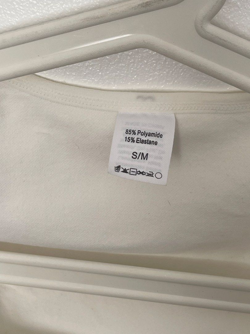 White Short Sleeve Square Neck Seamless Bodysuit S/M (Category: Blouses) located in Manila. Submitted by lovedbymidge (Listing ID 1470644608, Image 2). Description: 🩷 for s-m girlies 🚚 lalamove or grab express (sf shouldered by the buyer!) - Color: White - Style: Seamless short-sleeve bodysuit with square neckline and thong bottom - Features: Ribbed texture along the waist and bottom for a flattering fit - Perfect everyday basic piece for layer
