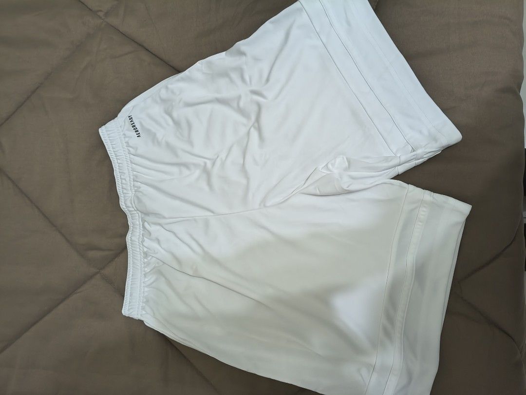 White Sports Shorts (Category: Activewear) located in Mandaluyong City. Submitted by yeojdurangorecto (Listing ID 1470630840, Image 3). Description: - Brand: Adidas - Color: White with black logo on lower right leg - Material: Lightweight fabric, ideal for workouts and casual wear - Waist: Elastic waistband with adjustable drawstring - Measurements: 30cm waist width, 42cm length, 30cm leg opening - Condition: Excellent RUSH ITEM!!! ONE PIECE ONLY