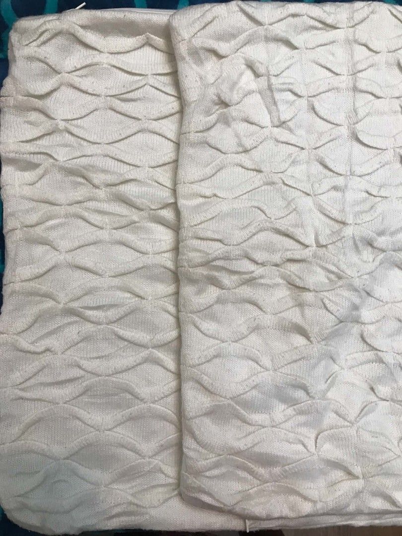 White textured decorative cushion cover set pillow case (Category: Cushions & Throws) located in Imus. Submitted by stop_shop7 (Listing ID 1470651033, Image 3). Description: - Set of 2 white cushion covers - Soft knit fabric with a stylish geometric wave pattern - Clean off-white color complements any neutral home decor - Standard square shape with a seamless hidden zipper closure - Easy to use and 100% machine washable.