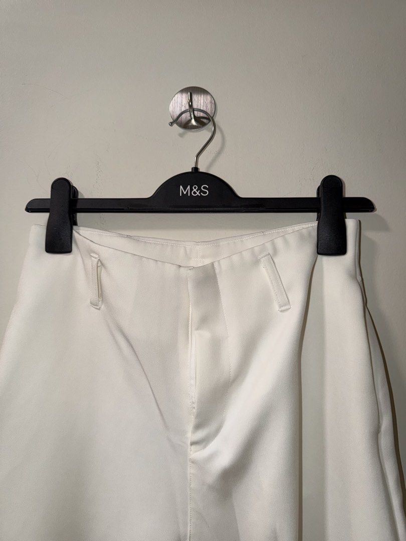 White Wide Leg Trousers Pants (Category: Jeans) located in Makati City. Submitted by andzr. (Listing ID 1470643454, Image 2). Description: - Style: Clean minimalist white wide leg trousers - Details: Structured waistband, belt loops, zip fly closure, and side pockets - With some black line stains (idk if can be removed).