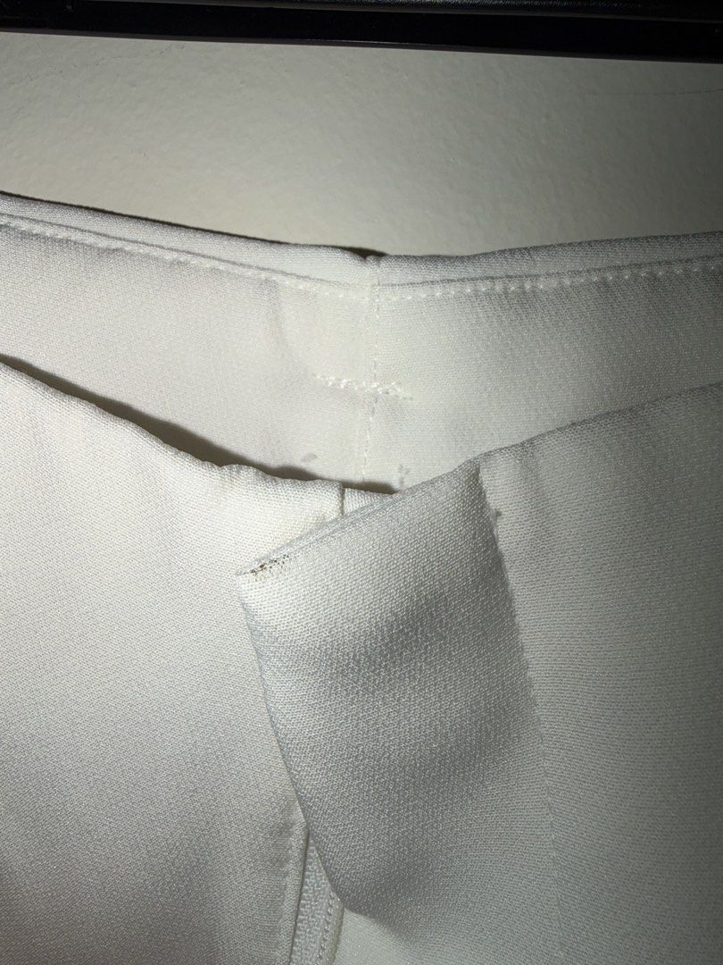 White Wide Leg Trousers Pants (Category: Jeans) located in Makati City. Submitted by andzr. (Listing ID 1470643454, Image 3). Description: - Style: Clean minimalist white wide leg trousers - Details: Structured waistband, belt loops, zip fly closure, and side pockets - With some black line stains (idk if can be removed).