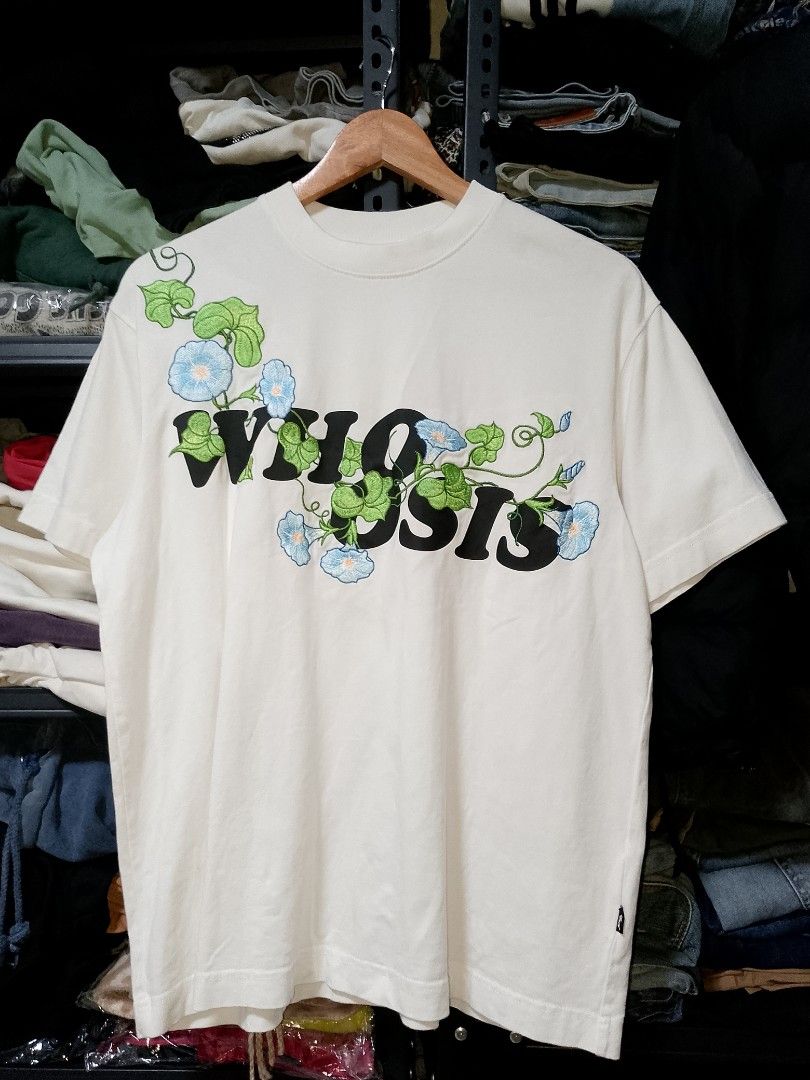 Whoosis Embroidered Floral White Tee (Category: Tshirts & Polo Shirts ) located in Manila. Submitted by mjthrifted_second (Listing ID 1470608513, Image 1). Description: - Brand: Whoosis -Size: Small -Dimes: 22/28 - Color: White with blue morning glory flowers and green vines - Material: 100% cotton - Design: Detailed floral embroidery and bold black typography on front and back - Fit/Style: Short sleeves, crew neck.