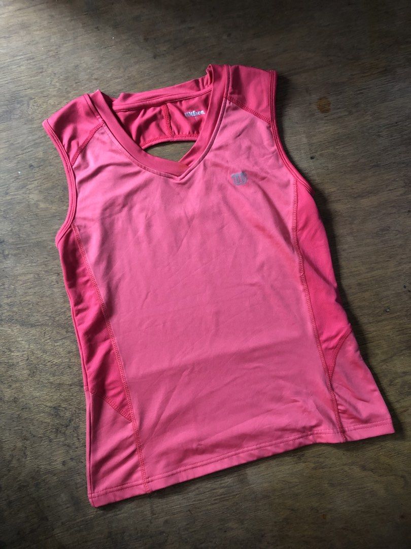 Wison Athletic Tank top (Category: Activewear) located in Davao. Submitted by blufinds (Listing ID 1470638110, Image 2). Description: This image shows a bright pink women’s athletic tank top from Wilson featuring a V-neck, sleeveless cut, and a cross-strap back detail..