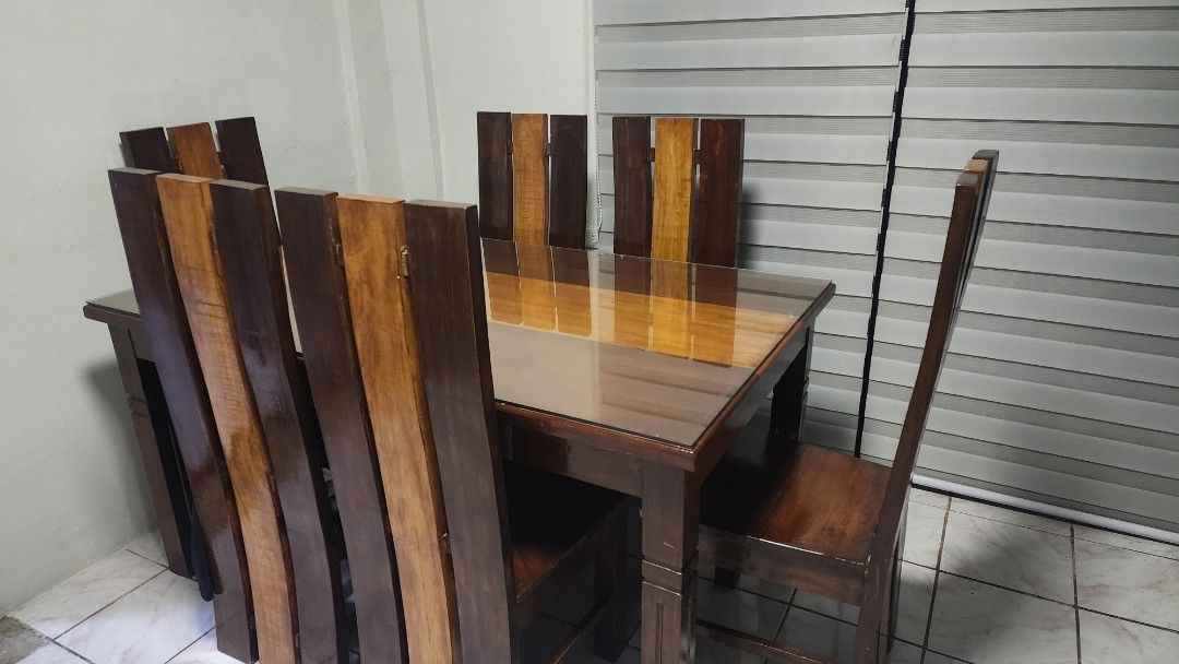 Wooden Dining Table Set with Six Chairs (Category: Tables & Sets) located in Taguig. Submitted by arnoldcb.800 (Listing ID 1470567737, Image 3). Description: - Set includes: 1 solid wood dining table and 6 matching chairs - Tabletop protection: Smooth glass cover included - Design: Sturdy multi-tone wood panels with dark and natural brown finishes - Capacity: Comfortably seats 6 people - Style: Clean modern rustic look, perfect for any dining spa