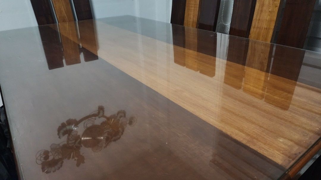 Wooden Dining Table Set with Six Chairs (Category: Tables & Sets) located in Taguig. Submitted by arnoldcb.800 (Listing ID 1470567737, Image 2). Description: - Set includes: 1 solid wood dining table and 6 matching chairs - Tabletop protection: Smooth glass cover included - Design: Sturdy multi-tone wood panels with dark and natural brown finishes - Capacity: Comfortably seats 6 people - Style: Clean modern rustic look, perfect for any dining spa