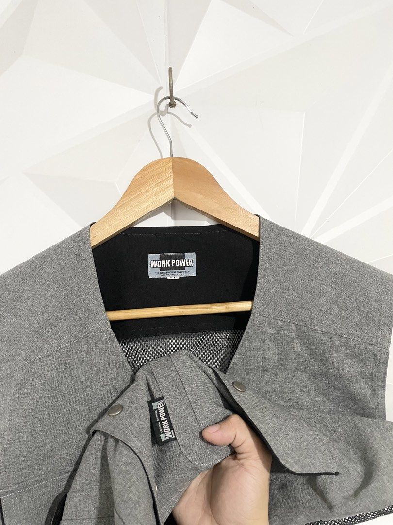 Work Power Grey Utility Vest Size L (Category: Vests) located in Cabuyao City. Submitted by ParadisethriftedPh (Listing ID 1470729641, Image 3). Description: Cr: 9.8/10 Dimensions W: 21 L: 24 - Brand: Work Power - Size: L - Color: Grey with black mesh lining - Features: Multiple front pockets with button flaps, small D-ring on the right chest, breathable mesh back - Closure: Front button - Condition: Clean, great pre-loved condition - Style: Perf
