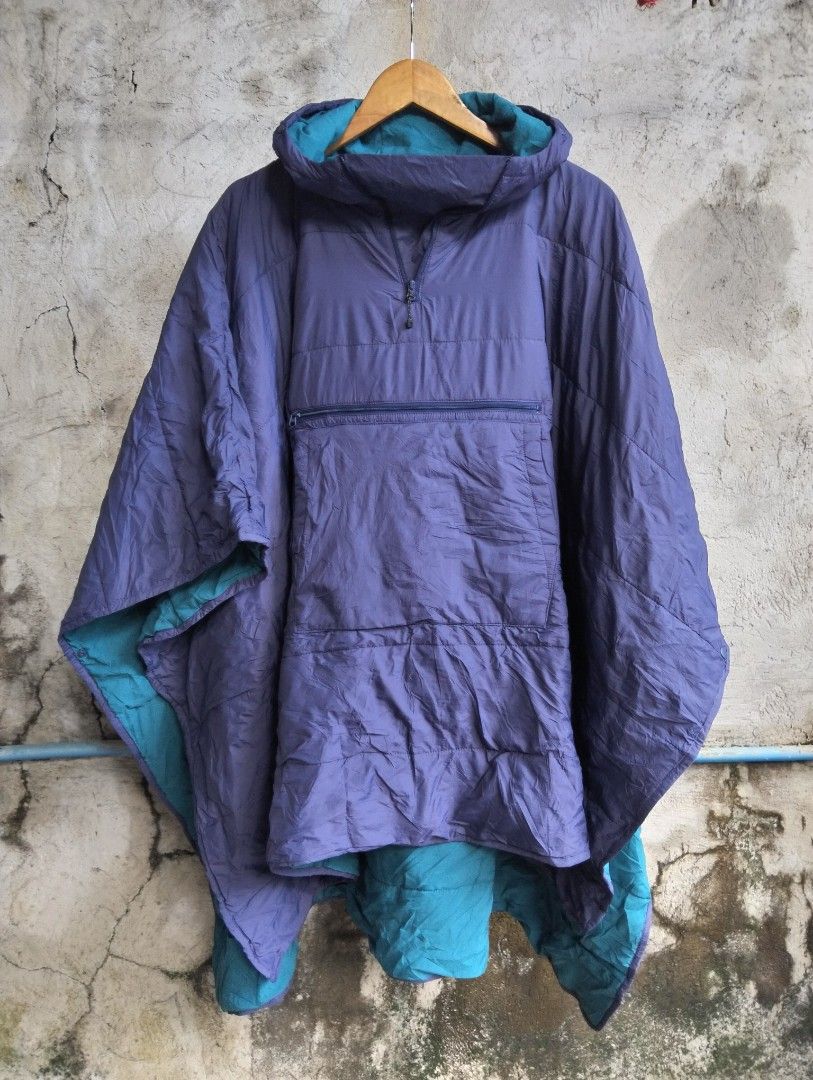 Workman FieldCore Outdoor Puffer Poncho Cloak Jacket (Category: Coats, Jackets and Outerwear) located in Malolos. Submitted by rthrift2026 (Listing ID 1470607909, Image 1). Description: Type: Hooded Puffer Poncho / Cloak Jacket • Colorway: Two-tone Purple (Exterior) and Teal/Cyan (Interior) • Features: Half-zip pullover with hood, large front utility center pocket with zipper, side snap buttons for adjustable sleeve fit, padded/insulated for extr