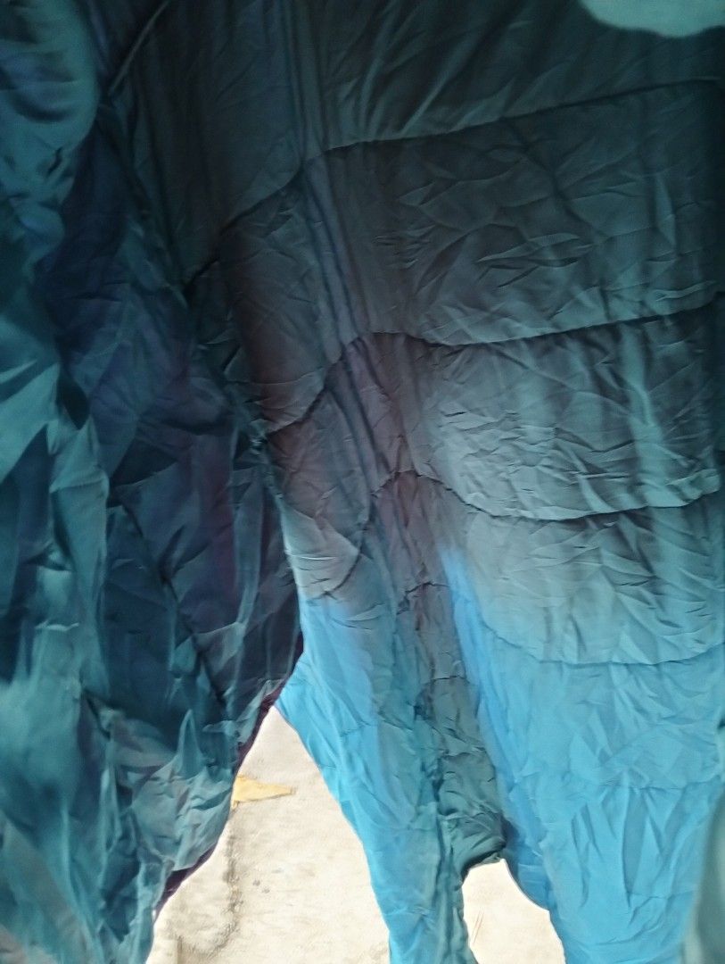 Workman FieldCore Outdoor Puffer Poncho Cloak Jacket (Category: Coats, Jackets and Outerwear) located in Malolos. Submitted by rthrift2026 (Listing ID 1470607909, Image 3). Description: Type: Hooded Puffer Poncho / Cloak Jacket • Colorway: Two-tone Purple (Exterior) and Teal/Cyan (Interior) • Features: Half-zip pullover with hood, large front utility center pocket with zipper, side snap buttons for adjustable sleeve fit, padded/insulated for extr