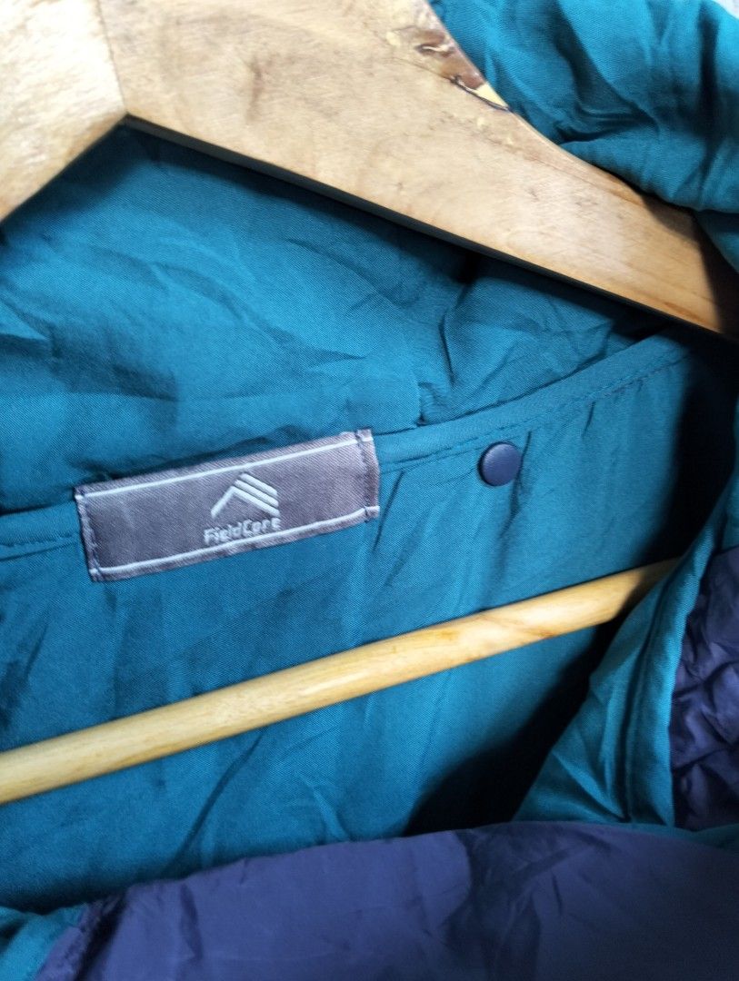 Workman FieldCore Outdoor Puffer Poncho Cloak Jacket (Category: Coats, Jackets and Outerwear) located in Malolos. Submitted by rthrift2026 (Listing ID 1470607909, Image 2). Description: Type: Hooded Puffer Poncho / Cloak Jacket • Colorway: Two-tone Purple (Exterior) and Teal/Cyan (Interior) • Features: Half-zip pullover with hood, large front utility center pocket with zipper, side snap buttons for adjustable sleeve fit, padded/insulated for extr