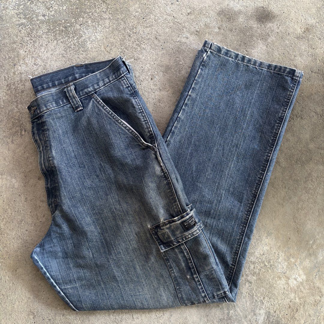 Wrangler Cargo Denim Jeans Size 36x32 Blue (Category: Jeans) located in Batangas. Submitted by phthriftpingzz (Listing ID 1470636639, Image 3). Description: - Brand: Wrangler - Style: Cargo denim jeans with relaxed straight leg fit - Color: Classic blue wash - Size: 36x32 - Material: 65% cotton, 35% polyester - Features: Multiple utility pockets, button closure, and zipper fly - Condition: Regular wear at hems and edges, perfect for daily casual 