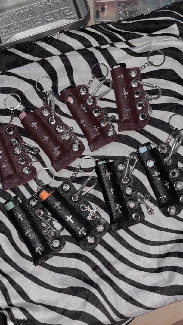 Y2K Goth Cross Leather Lighter Case Keychain (Category: Luxury Accessories) located in Manila. Submitted by bernabeclo75042 (Listing ID 1470603195, Image 3). Description: - Edgy leather lighter case with handmade details - Features metal grommets and cross charms for a grunge/punk aesthetic - Includes a secure keyring and clip to attach anywhere - Snug fit for standard disposable lighters - Available in 2 colors: Black and Maroon 300 php comes wi