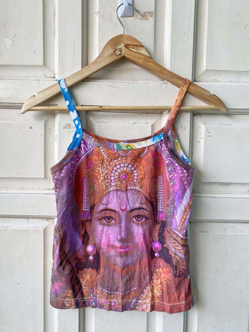 Y2k graphic cami (Category: Others Tops) located in Argao. Submitted by royalowl-888 (Listing ID 1470650991, Image 1). Description: Y2k graphic cami back to back print width 14.5 length 19 excellent condition 9.8/10 color rate and cloth rate no issue location visayas.
