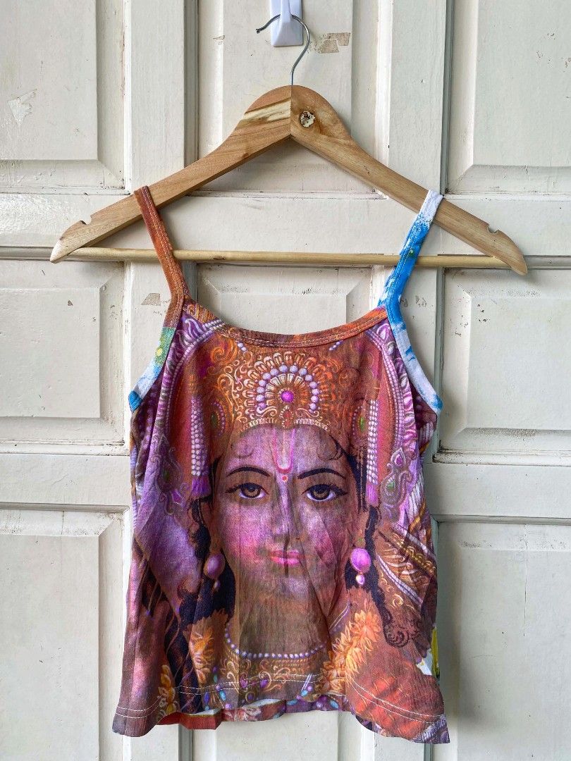 Y2k graphic cami (Category: Others Tops) located in Argao. Submitted by royalowl-888 (Listing ID 1470650991, Image 2). Description: Y2k graphic cami back to back print width 14.5 length 19 excellent condition 9.8/10 color rate and cloth rate no issue location visayas.