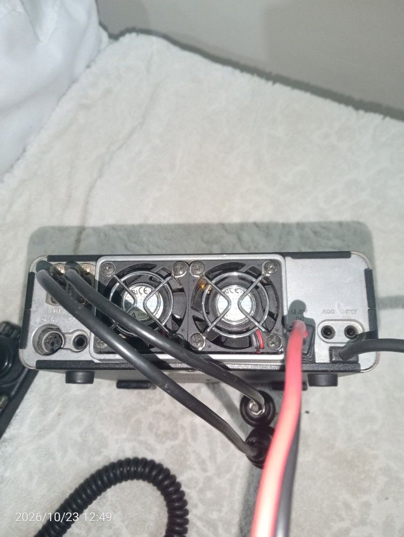 Yaesu FT-100 HF/VHF/UHF All Mode Transceiver (Category: Walkie-Talkie) located in Meycauayan. Submitted by alfredo.r.lim.jr (Listing ID 1470653094, Image 2). Description: - Model: Yaesu FT-100 HF/VHF/UHF all-mode amateur radio transceiver - Condition: Used unit, fully tested and working, comes fully wired with attached power cables - Design: Black casing, front display panel, multi-function dial, and top speaker grille - Rear Panel: Equipped with