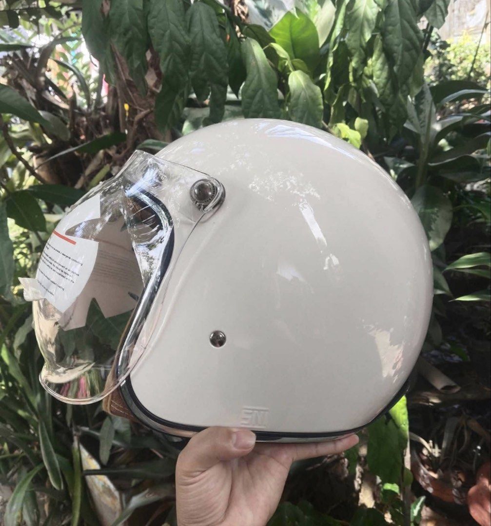 Yamaha Classic Helmet White with Visor (Category: Helmets and other Riding Gears) located in Manila. Submitted by sheinevida (Listing ID 1470722393, Image 2). Description: medium size vintage look - Brand: Yamaha Classic - Color: Glossy white with stylish brown inner padding and mesh details - Condition: Brand new, never used, with original tag still on the visor - Visor: Clear visor with original protective sticker and warning labels intact - In