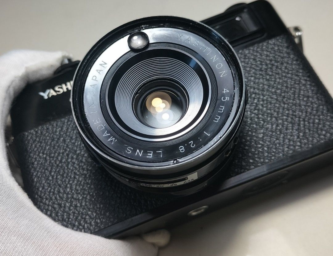 Yashica MG-1 Rangefinder Film Camera (Category: Cameras) located in Paranaque City. Submitted by zenfalcon.e8286d (Listing ID 1470567953, Image 3). Description: Ready to use... -Good working condition -Clad recently -Clean lens&VF/RFpatch- ok -Exposure: Auto Aperture priority(Accurate) -Slow/Over signal (works) -Working timer -Has light seals -Comes with battery and adapter,generic lenscap and strap - Presentable... .