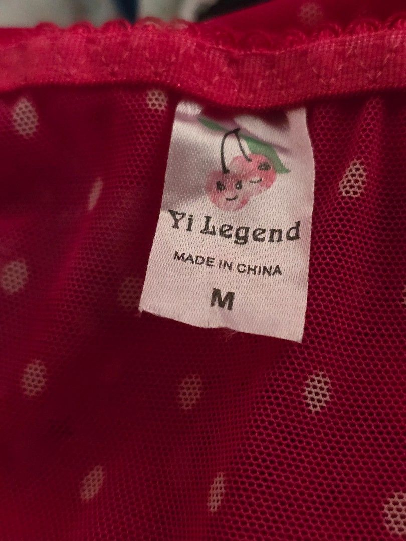 Yi Legend Pink Polka Dot Camisole Size M (Category: Sleeveless) located in Dagupan City. Submitted by chislocker14 (Listing ID 1470598257, Image 3). Description: - Brand: Yi Legend - Size: M - Design: Pink polka dot sheer mesh camisole - Details: Black lace trim, front lace-up with black ribbons.