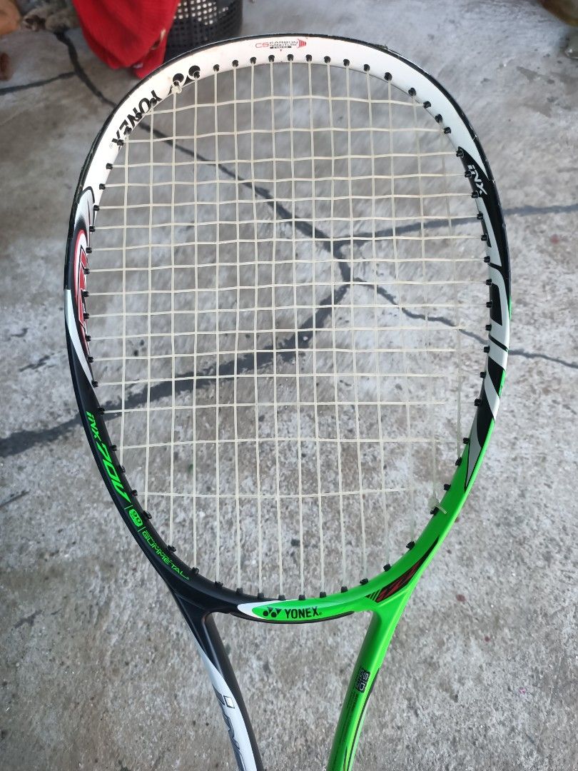 Yonex Nanoray 70DX Badminton Racket (Category: Racket and Ball Sports) located in Taguig. Submitted by grandfish_55ab5c (Listing ID 1470566939, Image 1). Description: - Brand/Model: Yonex Nanoray 70DX - Color: Black and Green - Condition: Strung and ready to play, with normal wear on the frame from regular court use; grip tape needs replacing soon - Skill Level: Ideal for intermediate players - Key Features: Delivers reliable speed and control.