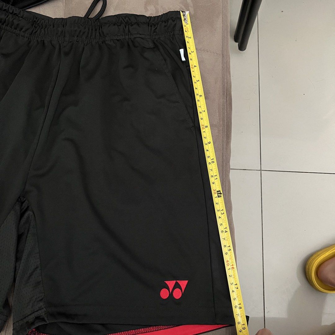 Yonex trubreeze Black & Red (Category: Activewear) located in Manila. Submitted by coolcloud_9e66fe (Listing ID 1470611376, Image 2). Description: RFS: Wrong size original price ₱1,600 selling for only - ₱800 - Brand: Yonex - Color: Black with vibrant pink accents and logo - Waist: Elastic with adjustable drawstring (approx. 35 cm flat lay) - Length: Approx. 48 cm total, 29 cm inseam - Features: Breathable mesh inner leg panels and dual side pock