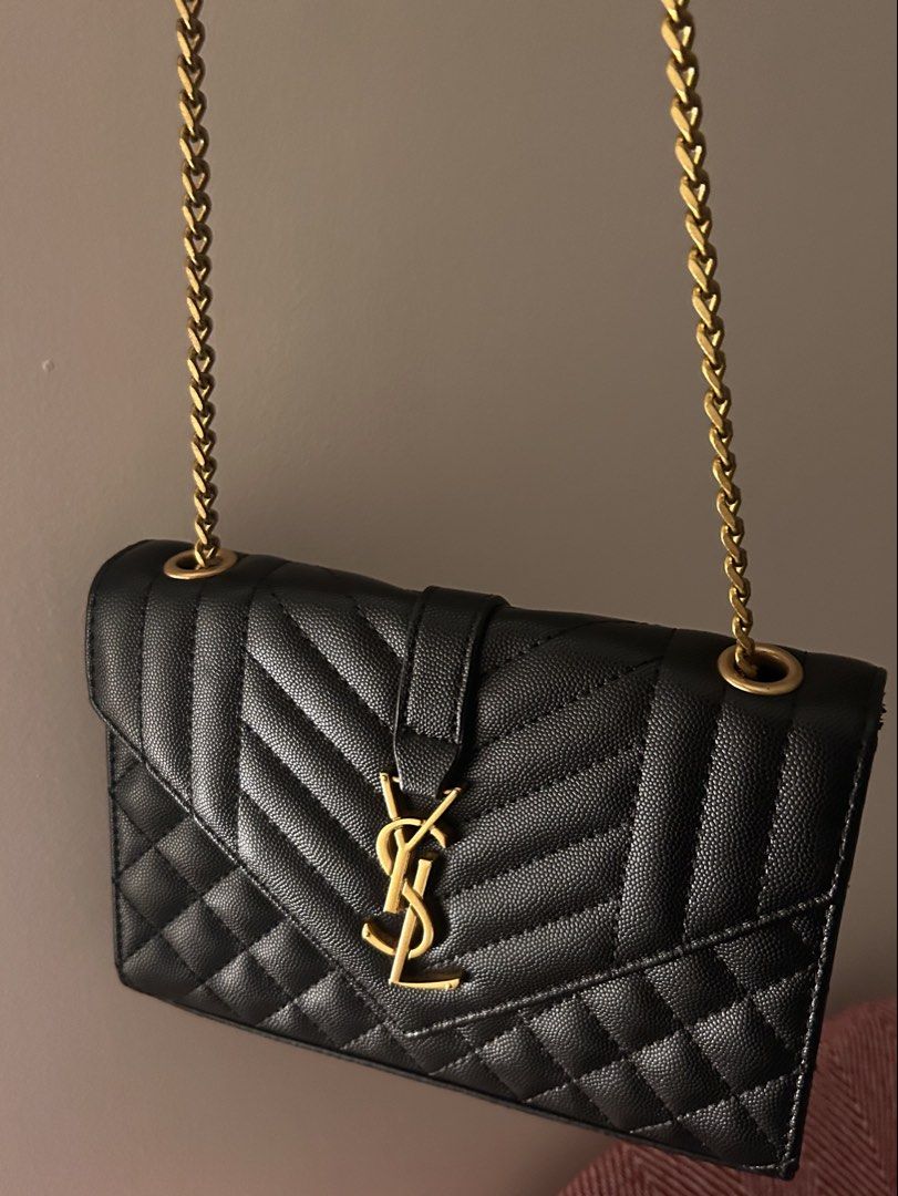 YSL shoulder bag / wallet on chain (Category: Cross-body Bags) located in Makati City. Submitted by ladybugsie (Listing ID 1470718256, Image 2). Description: Style it in many ways! As shoulder bag or cross body. Minimal chipping of leather on the right flap (refer to last photo).