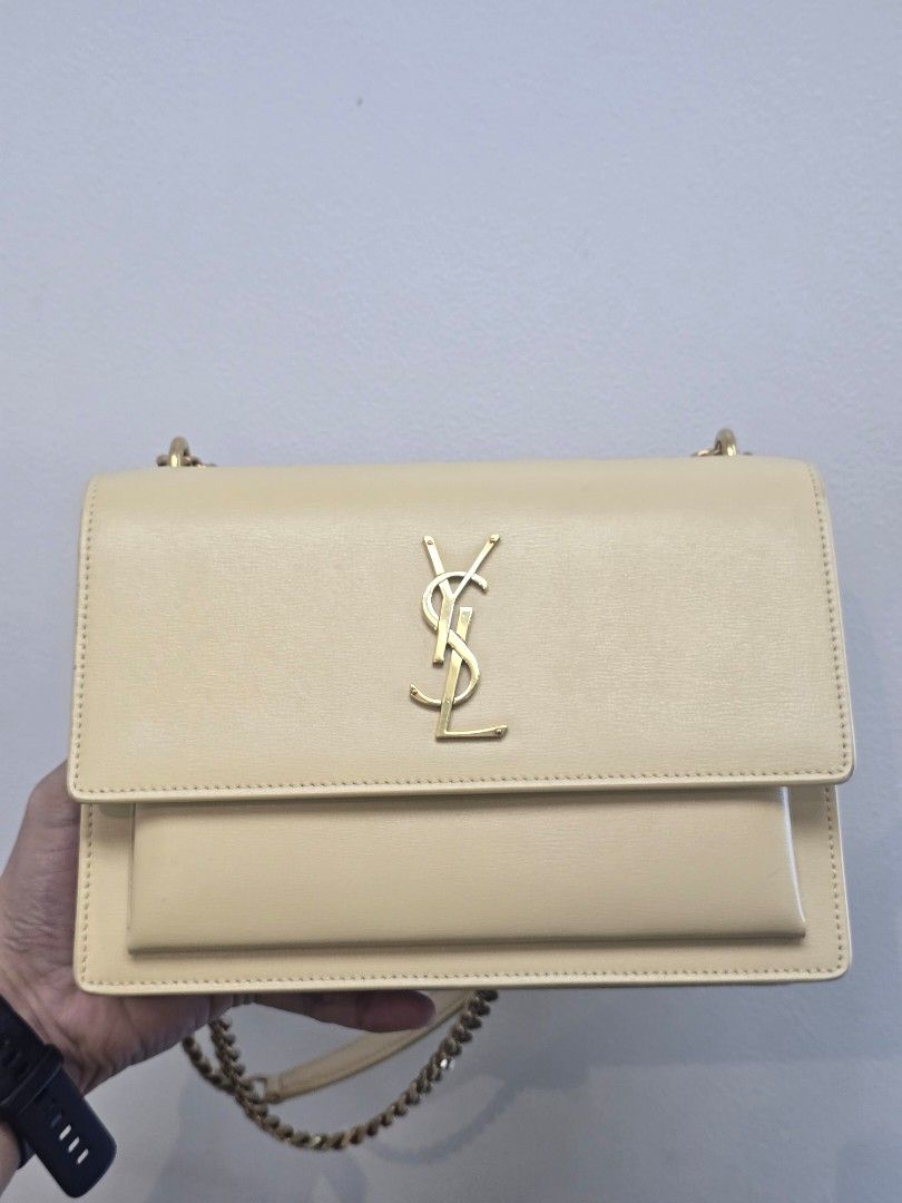 YSL Sunset Medium Beige Leather Chain Bag (Category: Luxury Bags & Wallets) located in Taguig. Submitted by mluxeph (Listing ID 1470606384, Image 1). Description: YSL Sunset Medium Beige Leather Chain Bag Material: Calfskin leather Stamp: YSL442906 0622 Interior: One open pocket, one open compartment and two main compartments Measurements: 8.75”L X 3”W X 6”H Handle Drop: 20.5" adjustable Hardware: Gold tone Inclusions: Care booklet.