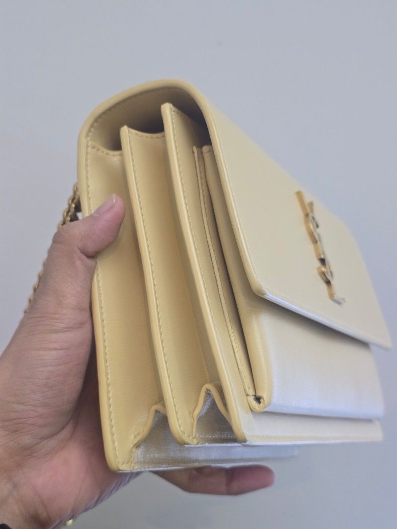 YSL Sunset Medium Beige Leather Chain Bag (Category: Luxury Bags & Wallets) located in Taguig. Submitted by mluxeph (Listing ID 1470606384, Image 3). Description: YSL Sunset Medium Beige Leather Chain Bag Material: Calfskin leather Stamp: YSL442906 0622 Interior: One open pocket, one open compartment and two main compartments Measurements: 8.75”L X 3”W X 6”H Handle Drop: 20.5" adjustable Hardware: Gold tone Inclusions: Care booklet.