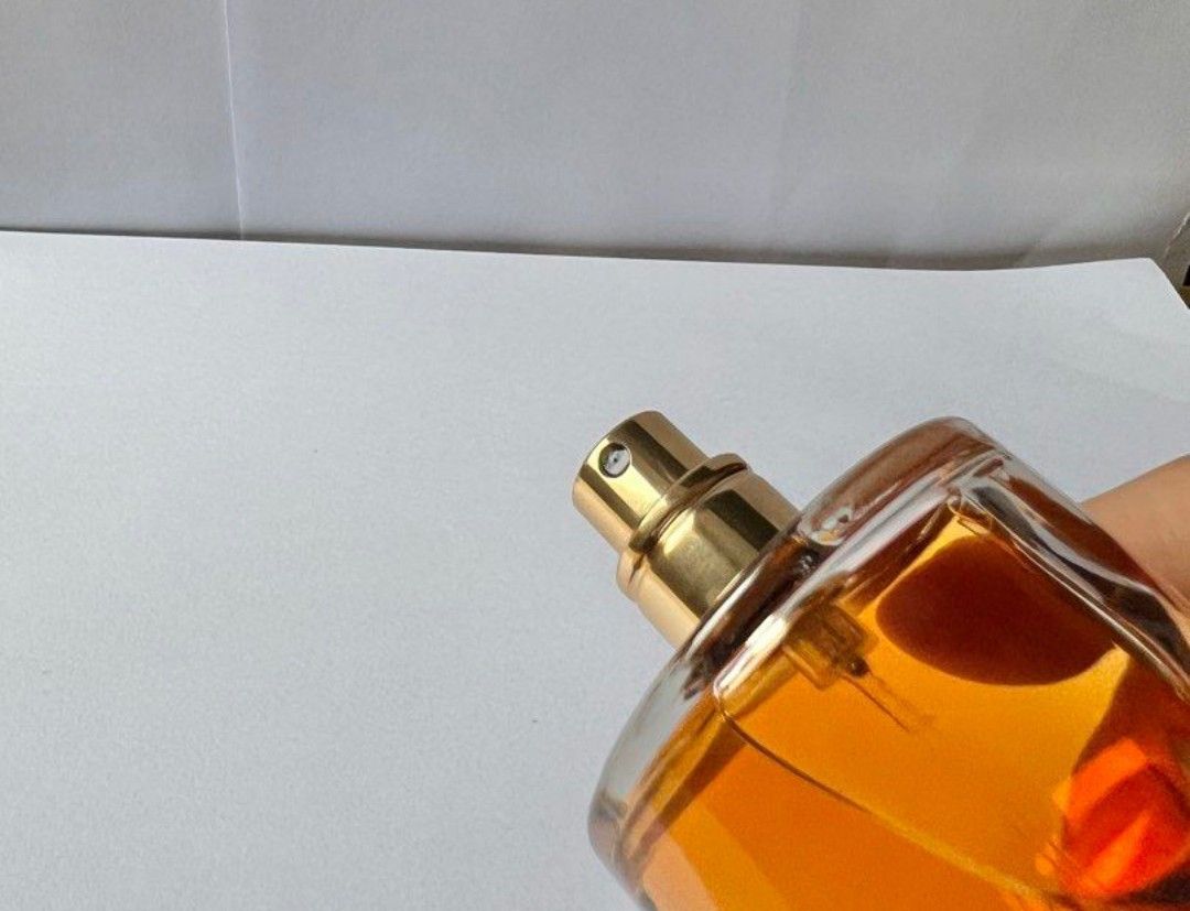 Yves Saint Laurent Eau de Parfum 100ml (Category: Fragrance & Deodorants) located in Santa Rosa. Submitted by chindeclutters (Listing ID 1470564974, Image 3). Description: - Brand: Yves Saint Laurent (YSL) Eau de Parfum - Size: 3.4 fl oz / 100 ml (Full bottle) - Bottle: Iconic hourglass shape with a textured gold cap - Details: Batch code 14150, made in USA by Interparfums - Fragrance: Rich amber color visible inside - Condition: Almost full, ide