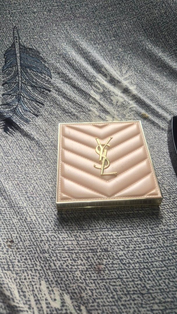 Yves Saint Laurent Makeup Palette (Category: Makeup) located in Manila. Submitted by corradelar45849 (Listing ID 1470597099, Image 2). Description: - Brand: Yves Saint Laurent (YSL) - Design: Quilted beige cover with iconic gold Cassandre logo and built-in mirror - Shades: 6 versatile colors ranging from gold, bronze, to pink tones - Condition: Minimal usage, with original powder embossing still intact on several pans - Portability: Compact size,