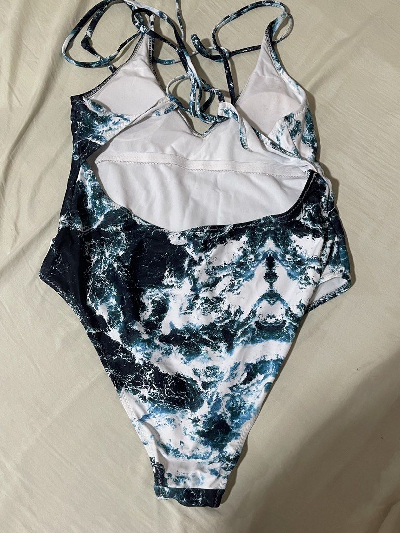 Zaful Wave Print One Piece Swimsuit Size M (Category: Bikinis & Swimsuits) located in Caloocan City. Submitted by sheshesheshesheshe13 (Listing ID 1470720246, Image 2). Description: - Brand: Zaful - Style: One-piece swimsuit with ocean wave print - Size: Medium (tag attached) - Details: Low open back, adjustable lace-up straps, white inner lining - Condition: Worn only once, super clean and beach-ready.