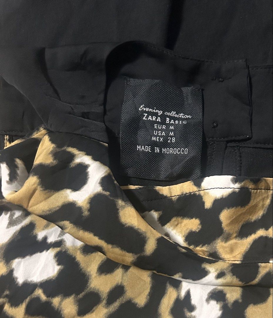 ZARA (Category: Dresses) located in Davao. Submitted by sart0ria85 (Listing ID 1470629536, Image 3). Description: Bold animal print in black, beige, and white with solid black shoulder panels. 62%POLYESTER 38%COTTON MADE IN MOROCCO 🇲🇦 MEDIUM. Size 6 EXCELLENT CONDITION (98/100).
