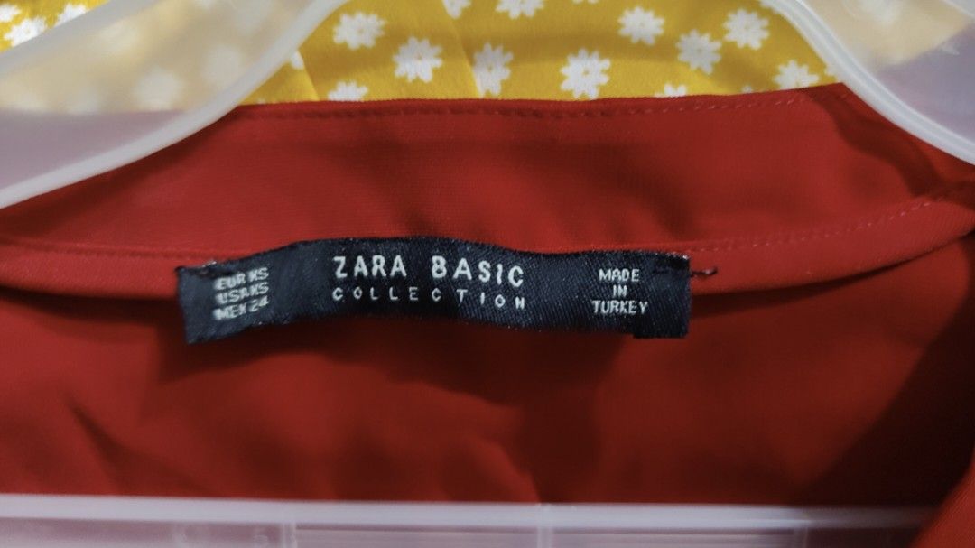 Zara Basic Red Long Sleeve Blouse (Category: Longsleeves) located in Makati City. Submitted by beedg (Listing ID 1470707522, Image 2). Description: - Brand: Zara Basic Collection - Size: EUR XS / US XS / MEX 24 - Color: Vibrant red (great pop of color) - Style: V-neck, long sleeves, relaxed fit, high-low hem with side slits - Material: Lightweight and comfortable - Origin: Made in Turkey - Versatility: Perfect for casual wear or office outfits - 