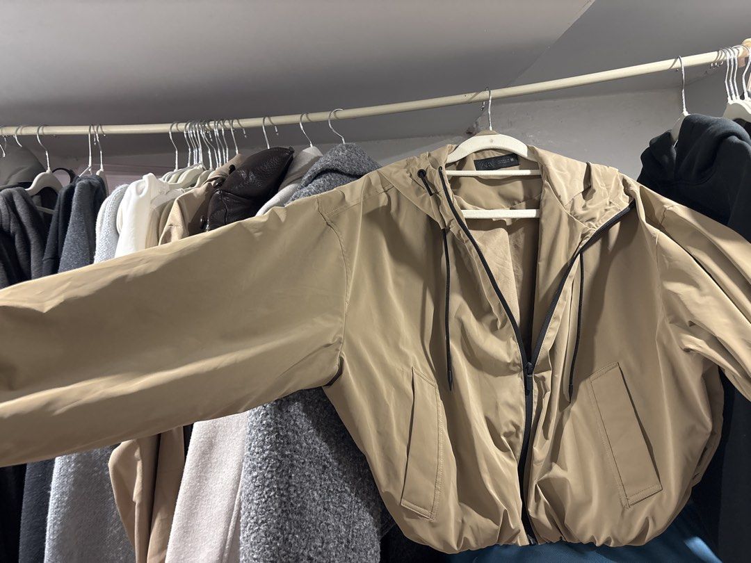Zara Beige Hooded Jacket (Category: Coats, Jackets and Outerwear) located in Tarlac. Submitted by somethinboutgyu (Listing ID 1470674380, Image 1). Description: - Brand: Zara - Size: Small (S) - Color: Classic beige with contrasting dark zipper and black drawstrings - Closure: Full zip front - Features: Elastic hem and sleeve cuffs, two functional side pockets - Material: Smooth synthetic fabric - Origin: Made in Cambodia - Condition: Excellent, 