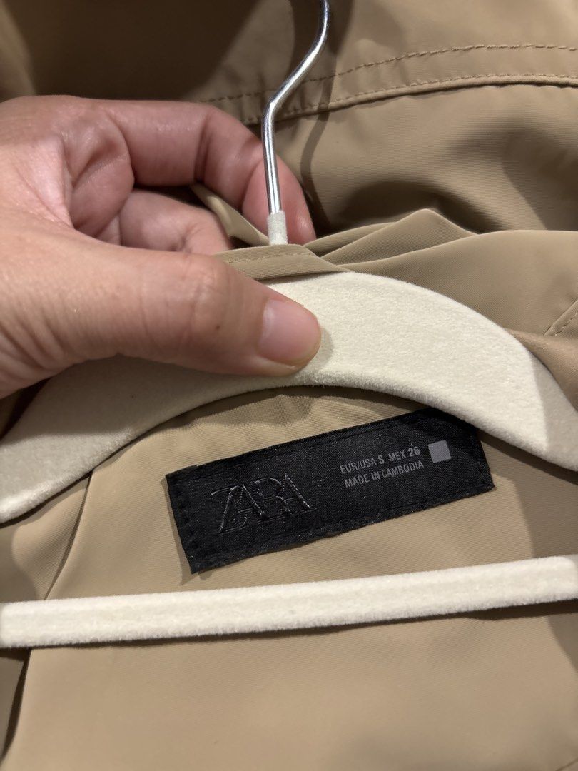 Zara Beige Hooded Jacket (Category: Coats, Jackets and Outerwear) located in Tarlac. Submitted by somethinboutgyu (Listing ID 1470674380, Image 2). Description: - Brand: Zara - Size: Small (S) - Color: Classic beige with contrasting dark zipper and black drawstrings - Closure: Full zip front - Features: Elastic hem and sleeve cuffs, two functional side pockets - Material: Smooth synthetic fabric - Origin: Made in Cambodia - Condition: Excellent, 