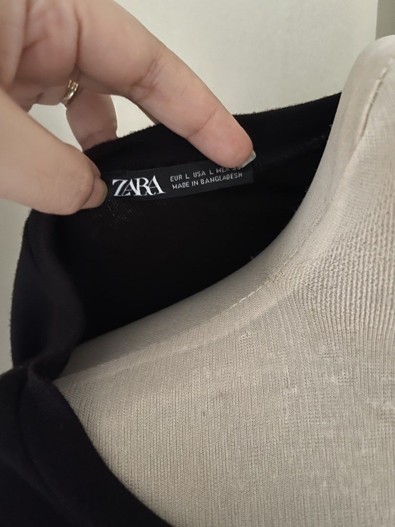Zara Black Crop Tee Size L (Category: Shirts) located in Cainta. Submitted by zlove111 (Listing ID 1470637731, Image 2). Description: - Brand: Zara - Style: Black crop top t-shirt with short sleeves and crew neckline - Size: Large (tag attached) - Origin: Made in Bangladesh - Color: Solid black - Versatile piece, pairs easily with high-waisted jeans or skirts - Condition: Brand new with tags cotton knit med -xl selling low due to minimal lints .