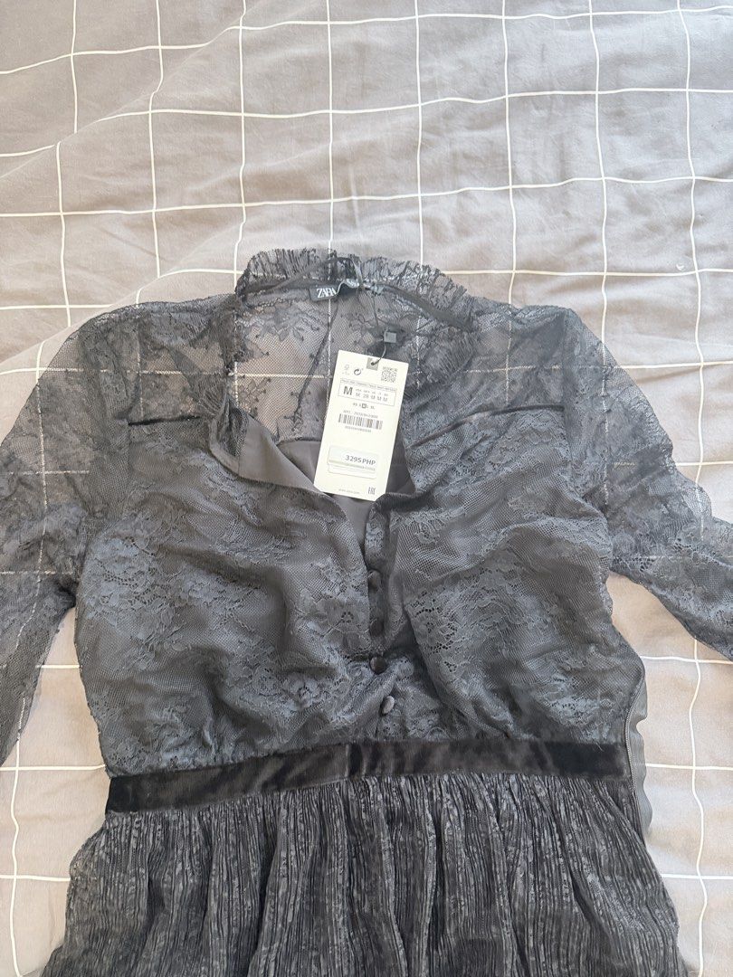 Zara Black Lace Mini Dress (Category: Dresses) located in Makati City. Submitted by purewind.a22dcd (Listing ID 1470594411, Image 3). Description: - Brand: Zara - Style: Black lace dress with long sleeves and button-up front - Size: Medium (M) - Condition: Brand new with original tags attached (PHP 3,295 retail price), never worn - Details: Features a flattering pleated skirt section and an elegant velvet waist detail - Perfect for: Date nights, 