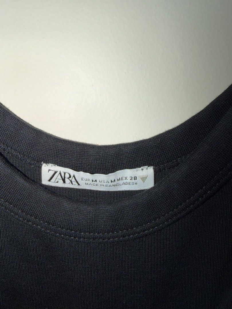 Zara Black Ribbed Bodysuit Size M (Category: Sleeveless) located in Makati City. Submitted by andzr. (Listing ID 1470642371, Image 2). Description: - Brand: Zara - Style: Ribbed black bodysuit - Details: Scoop neckline, thick tank straps, snap button closure - Fit: Stretchy, snug, and comfortable - Size: M - Condition: Clean and ready to wear.