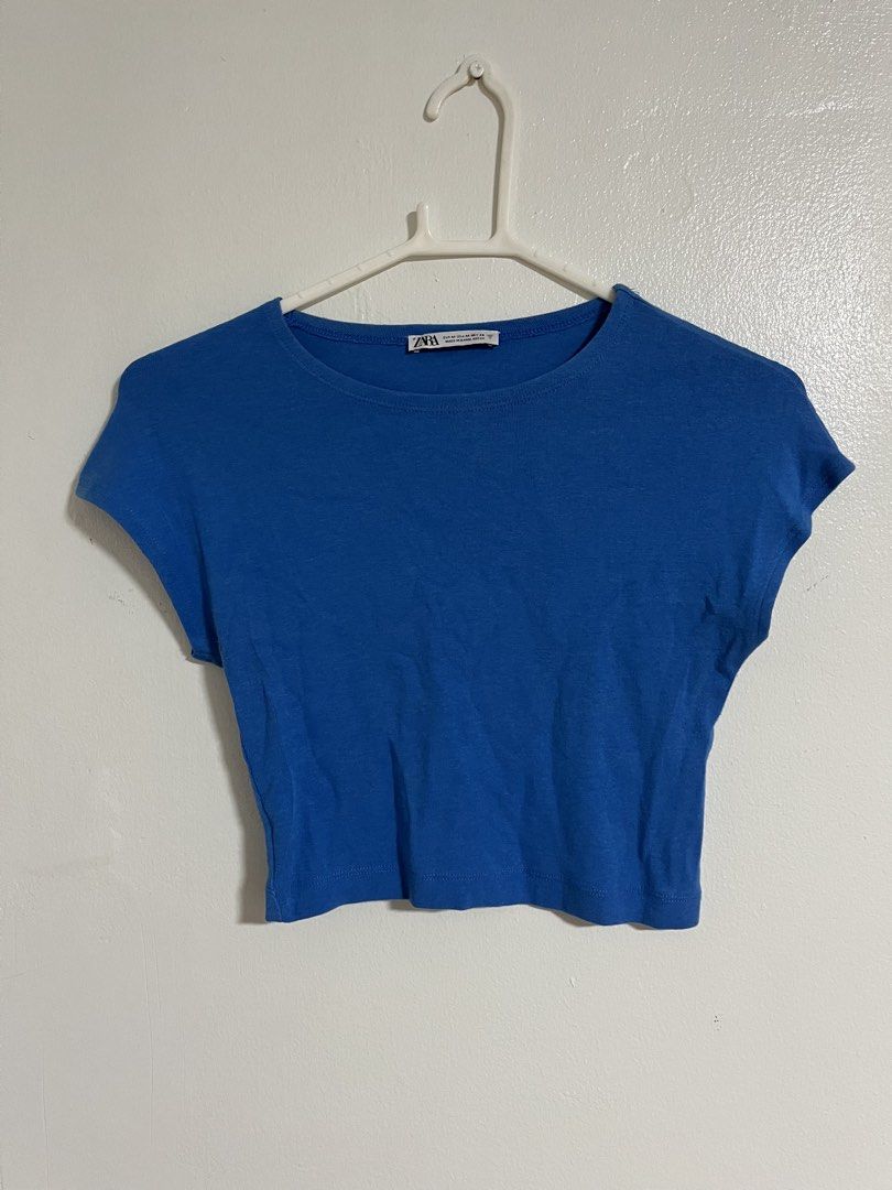 Zara Blue Crop Top (Category: Sleeveless) located in Cabuyao City. Submitted by rdtrmt (Listing ID 1470575548, Image 1). Description: - Brand: Zara - Size: M - Color: Bright blue - Material: Soft cotton - Design: Scoop neckline, short cap sleeves - Condition: Clean and still in good condition .