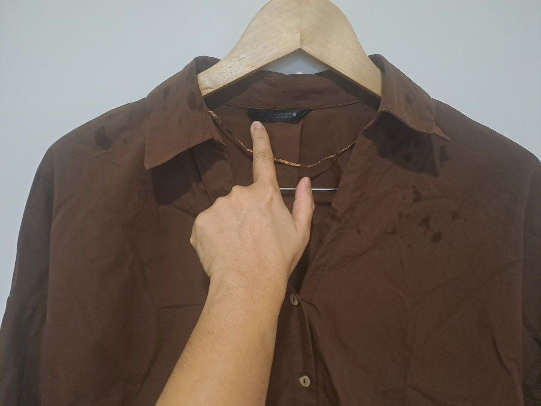 ZARA BROWN 3/4 SLEEVE (Category: Longsleeves) located in Manila. Submitted by joanbalde39643 (Listing ID 1470712342, Image 2). Description: The image shows a Zara brown, loose-fit button-down shirt with a classic collar and 3/4-length drop-shoulder sleeves..