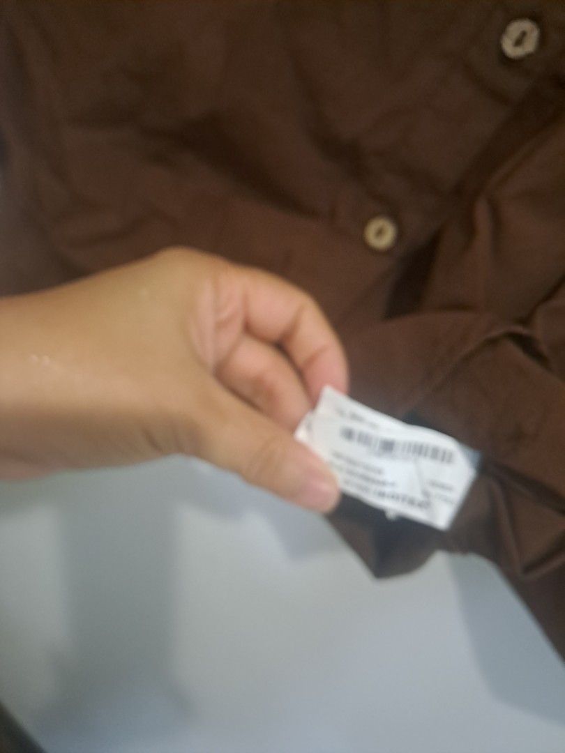 ZARA BROWN 3/4 SLEEVE (Category: Longsleeves) located in Manila. Submitted by joanbalde39643 (Listing ID 1470712342, Image 3). Description: The image shows a Zara brown, loose-fit button-down shirt with a classic collar and 3/4-length drop-shoulder sleeves..