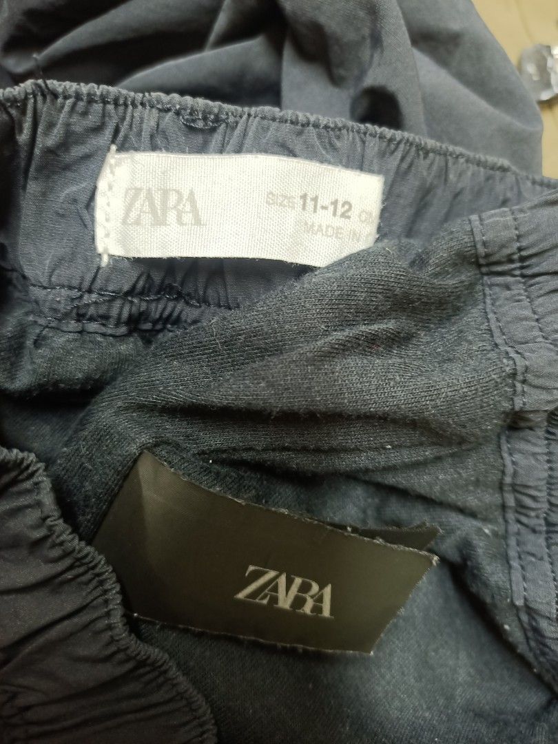 Zara Cargo Pants Size 11-12 Years Dark Navy (Category: Jeans) located in Bayombong. Submitted by rheaaa00530 (Listing ID 1470663535, Image 2). Description: - Brand: Zara - Color: Dark navy blue - Size: 11-12 years - Fit: Relaxed through the legs with a lightweight feel - Waistband: Elastic with integrated belt buckle - Pockets: Multiple utility side pockets with button flaps - Condition: Great for everyday casual wear.