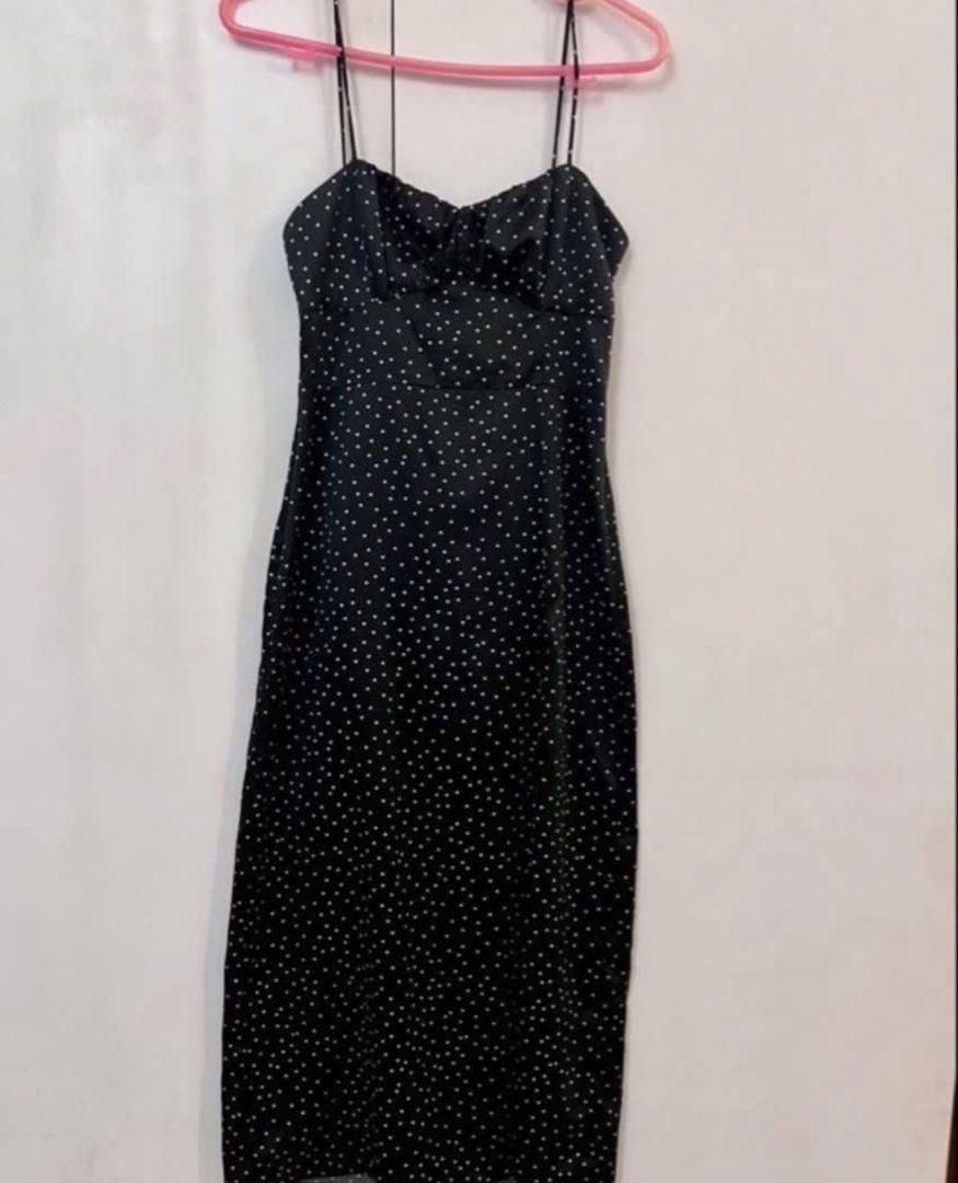 ZARA midi polka dot dress (Category: Dresses) located in Manila. Submitted by angelrm (Listing ID 1470631573, Image 2). Description: - Style: Black midi dress with white polka dots - Details: Thin spaghetti straps, sweetheart neckline, gathered bust, and front slit on the left leg - Condition: Worn once for a quick photo, practically brand new - Fit: Best fits Small to Medium - Versatility: Lightweight fabric, easy to style casually with sneakers